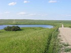 Prairie road in pothole country